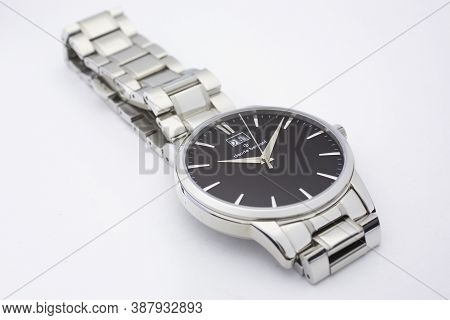 Geneve, Switzerland 01.10.2020 - Claude Bernard Man Swiss Made Watch Black Dial Metal Bracelet Isola