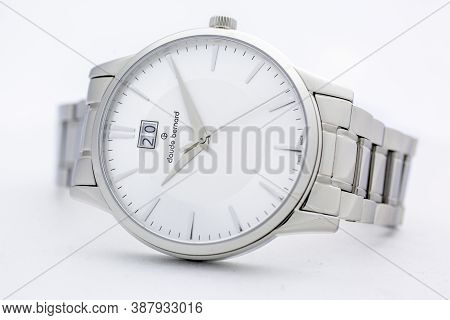 Geneve, Switzerland 01.10.2020 - Claude Bernard Man Swiss Made Watch White Dial Metal Bracelet Isola