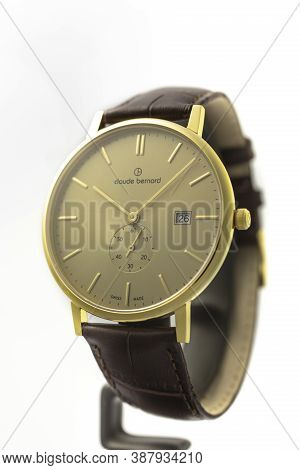 Geneve, Switzerland 01.10.2020 - Claude Bernard Man Swiss Made Watch Gold Pvd Coating Beige Dial Lea