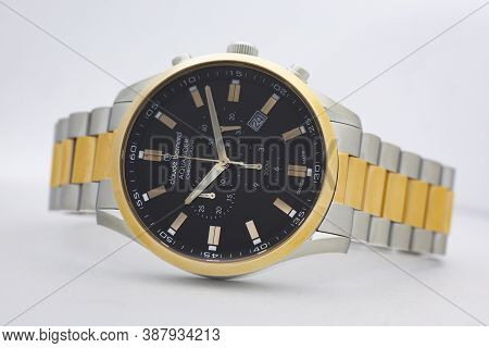 Geneve, Switzerland 01.10.2020 - Claude Bernard Man Swiss Made Watch Gold Pvd Coating Black Dial Met
