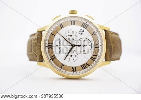 Geneve, Switzerland 01.10.2020 - Claude Bernard Man Swiss Made Watch Gold Pvd Coating White Dial Lea