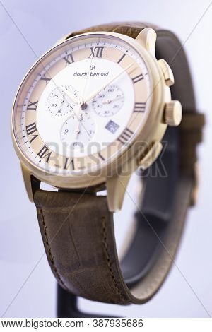 Geneve, Switzerland 01.10.2020 - Claude Bernard Man Swiss Made Watch Gold Pvd Coating Leather Strap 