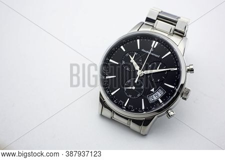 Geneve, Switzerland 01.10.2020 - Claude Bernard Man Swiss Made Watch Black Dial Isolated. Date Indic