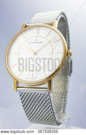Geneve, Switzerland 01.10.2020 - Claude Bernard Man Swiss Made Watch Gold Pvd Coating White Dial Met