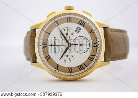 Geneve, Switzerland 01.10.2020 - Claude Bernard Man Swiss Made Watch Gold Pvd Coating Leather Strap 