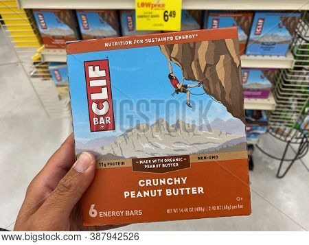 Maple Grove, Minnesota - September 14, 2020: Hand Holds A Box Of Crunchy Peanut Butter Clif Bars At 