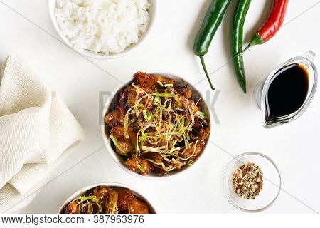 Spicy Garlic Fried Chicken (kkanpunggi). Asian Chicken In Sweet And Sour Sauce In Bowl Over White Ba