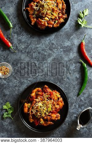 Spicy Garlic Fried Chicken (kkanpunggi). Asian Chicken In Sweet And Sour Sauce On Plate Over Dark St