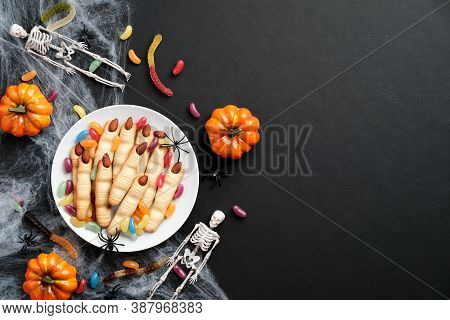 Happy Halloween Holiday Concept. Halloween Cookies In Form Of Witches Fingers, Pumpkins, Skeletons, 