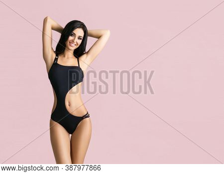 Slender And Young Girl With Beautiful And Fit Body. Woman In Swimsuit.