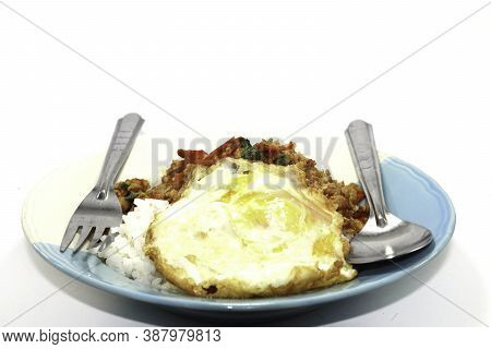 Rice With Basil, Minced Pork, Fried Egg, Delicious And Spicy Thai Food Is Popular All Over The World