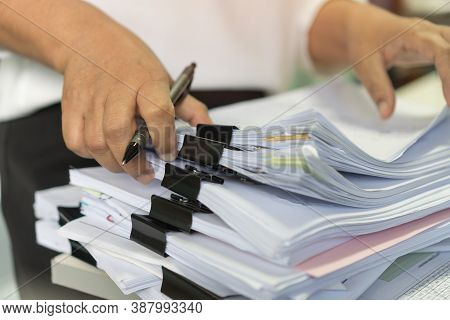 Office Workers Arranging Stacks Of Lot Documents Report Papers With Clips Waiting Be Managed On Desk