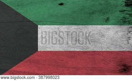Flag Of Kuwait On Wooden Plate Background. Grunge Kuwaiti Flag Texture, Green White And Red Color Wi