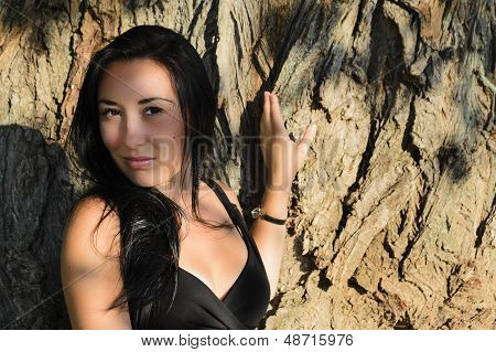 The Girl Near A Tree Trunk
