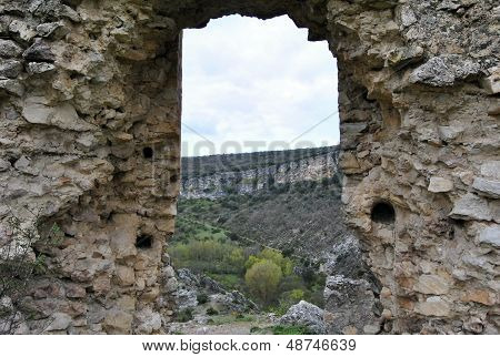 mountainous landscape through old ruins