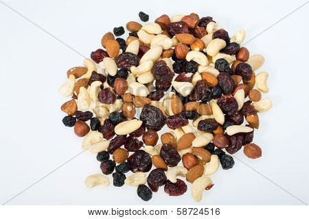 mixed nuts and dried fruits isolated on white background