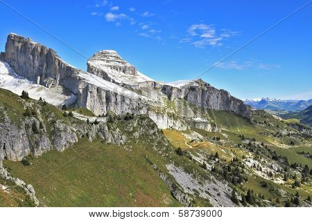Swiss Alps in early fall. Cold sharp rocks slightly sprinkled with the first snow 