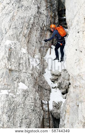 Alpinist climbing ferrata La torre di Toblin (2.617 m), Dolomites, Italy, Europe