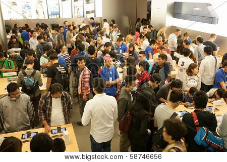 HONG KONG, CHINA - NOVEMBER 11, 2012: Buyers and shop assistants at Apple store in Hong Kong. Store is in a shopping center IFC Mall, it is very popular with locals and tourists visiting Hong Kong.