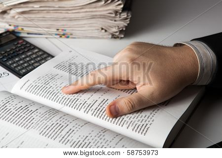 Man Is Looking For Information In The Dictionary