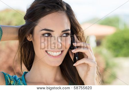 Close Up Of A Attractive Young Woman Speaking On Mobile Phone