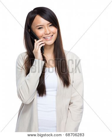 Asia young woman talking on mobile phone on white background