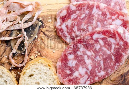 Sliced Salami On A Wood Board