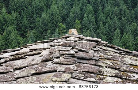 Traditional Roof Covered With Cap Stone
