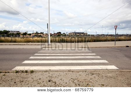 Pedestrian crossing in abandoned housing estate building site, Valencia region, Spain