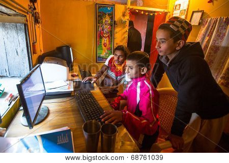 KATHMANDU, NEPAL - DEC 9, 2013: Unknown children in lesson on the computer at Jagadguru School. School established at 2013, to let new generation learn Sanskrit and preserve Hindu culture.