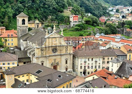 BELLINZONA, SWITZERLAND - JULY 4, 2014: The Collegiate Church and town of Bellinzona, seen from Castelgrande. The Renaissance building was built in 1517 by Tomaso Rodari, builder of Como Cathedral.