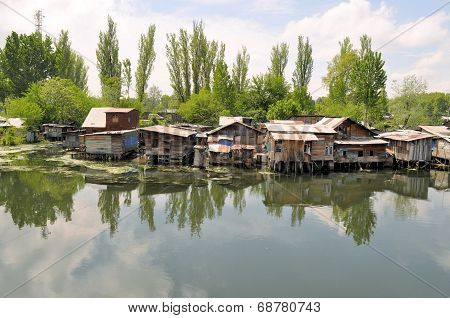 Slum houses near the river, Srinagar, India