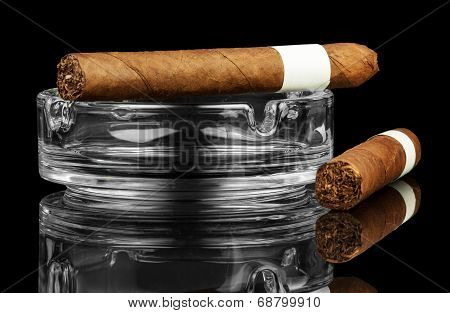 Smoking cigar in an ashtray