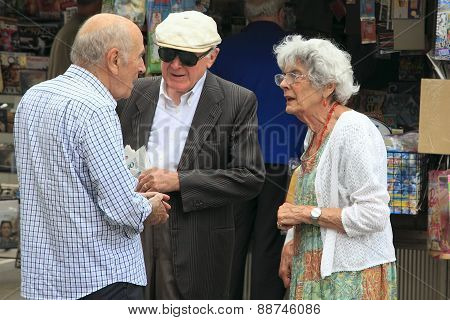 Venice, Mestre-june 29, 2014. Two Elderly Men And Women Talking On Piazza Erminio Ferretto In Italy.