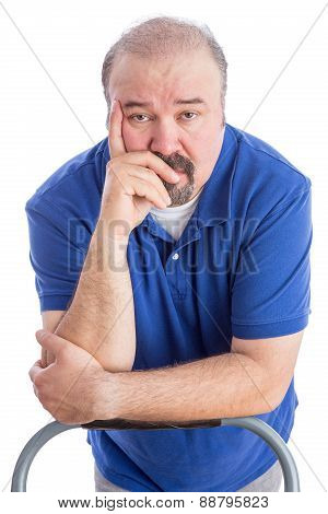 Serious Adult Man Leaning Against The Chair