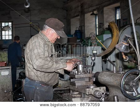Ukraine, Anthracite - May 15, 2013: Turner In The Workplace. Antratsitovsky Repair And Engineering W