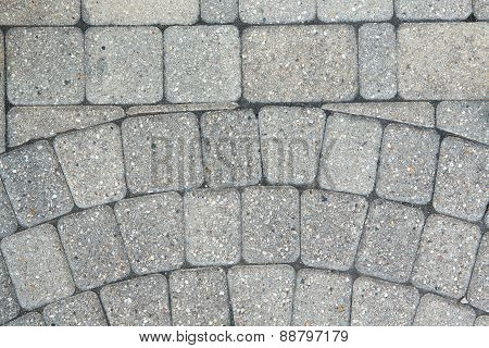 Circular Inlaid Pattern In Grey Brickwork