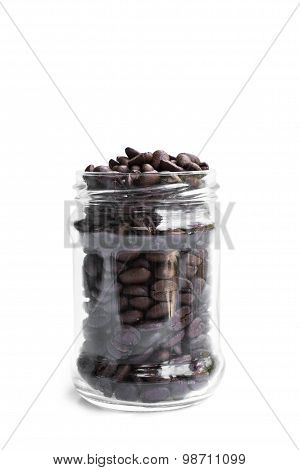 roasted coffee beans in transparent glass jar