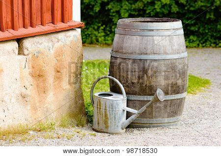 Wooden Barrel And Watering Can