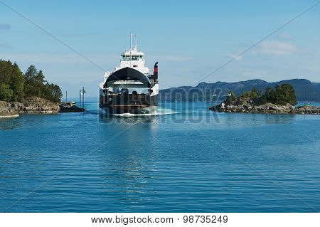 Ferry boatz arrives to the port in Tveit, Norway.