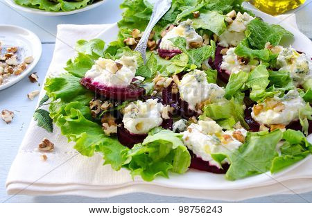 Beet Salad with goat cheese, walnuts, greens and herbs