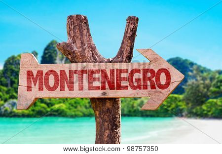 Montenegro wooden sign with beach background