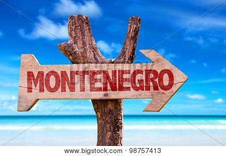 Montenegro wooden sign with beach background