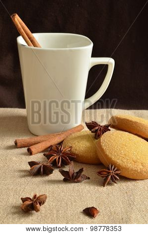 Tea with cookies and cinnamon
