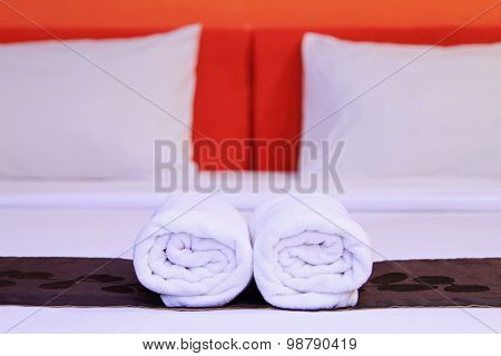 White Clean Towels On The Hotel Bed