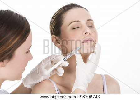 doctor doing botox injection to a woman