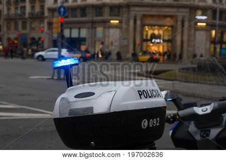 Spanish police car standing in the yard, Upper part with blue lights. Sirena