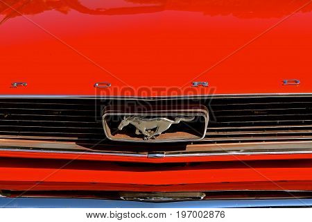 WEST FARGO, NORTH DAKOTA, July 20, 2017: The West Fargo Cruise night occurs each 3rd Thursday night in the summer months and features this refurbished 1965 Ford Mustang logo and grill.