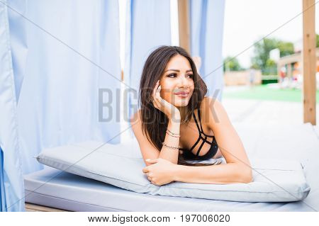 Woman Relaxing In Chaise Lounge At The Poolside. Summer Vocation