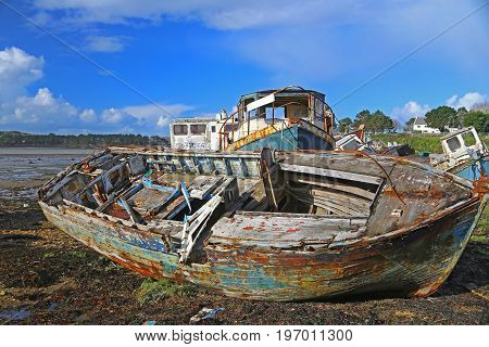 Wrecks of fishing boats at the Rostellec ships cemetery Crozon peninsula Finistere Brittany France